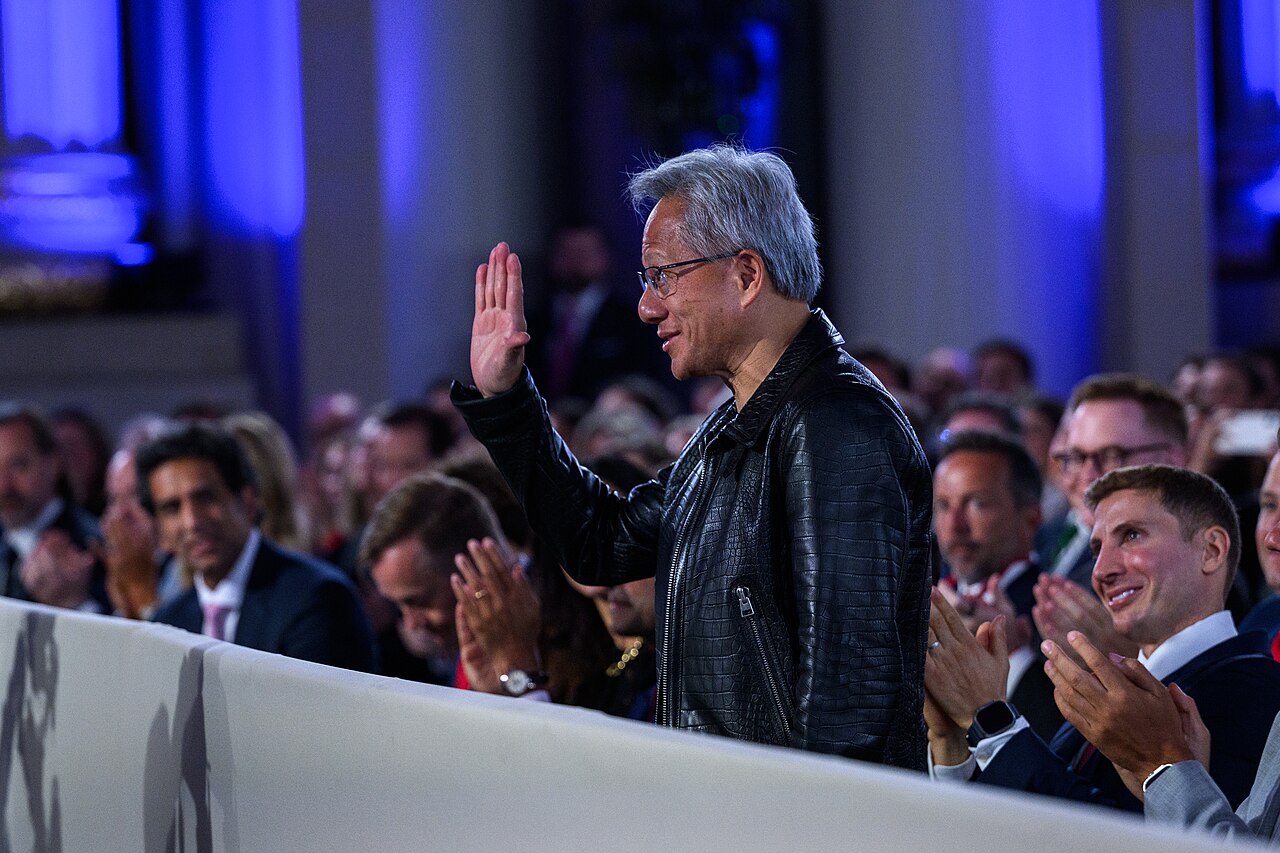 Nvidia CEO Jensen Huang Dismisses AI Regulation, Advocates for Industry-Led Safety — Nvidia CEO Jensen Huang is recognized by President Donald Trump during remarks at the White House AI Summit at Andrew W. Mellon Auditorium in Washington (54677035268)