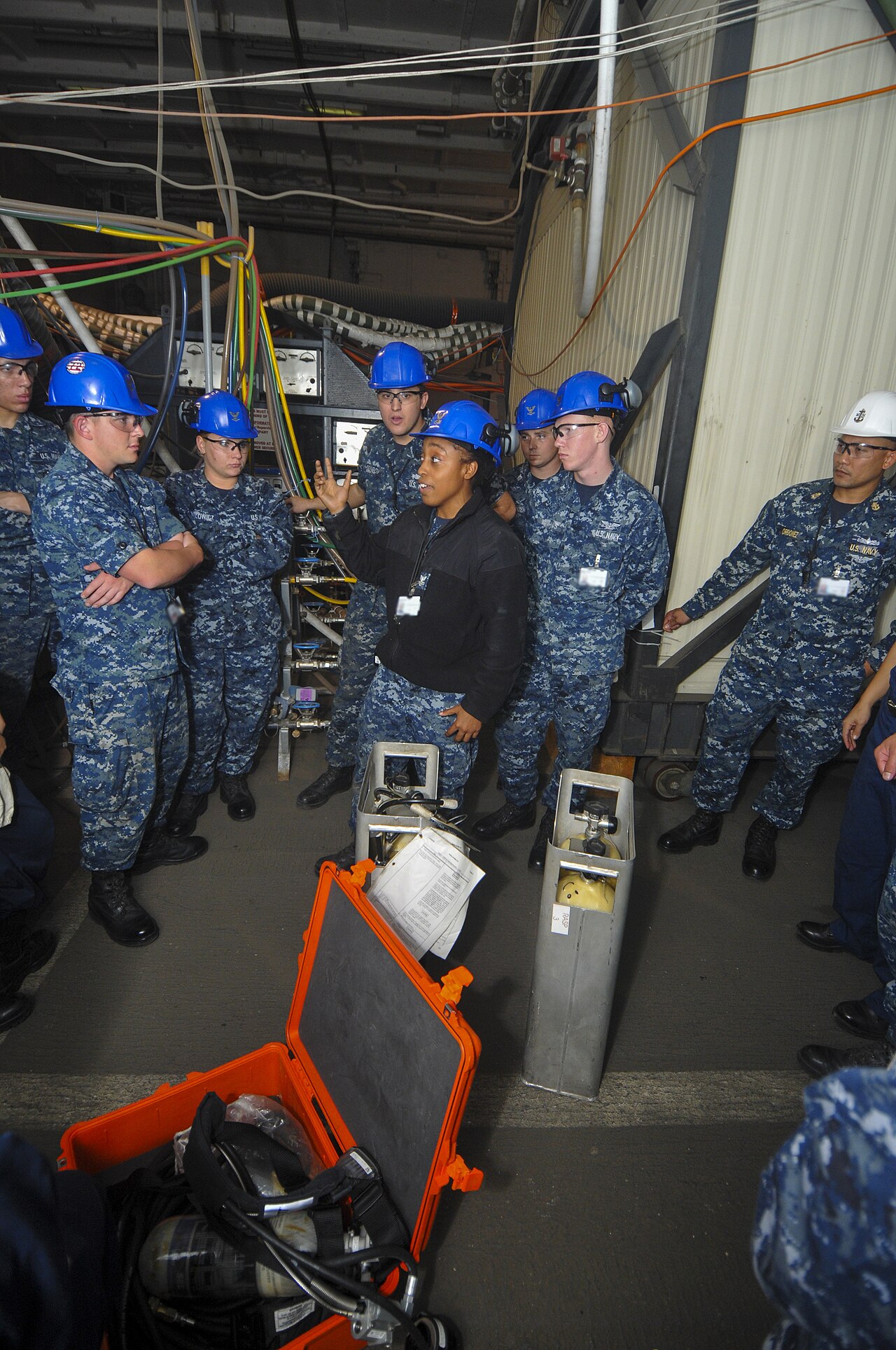 Instructor Overhauls Curriculum After AI Completes All Student Assignments — U.S. Navy Machinery Repairman 2nd Class Madison Robinson, center, an in-port emergency team instructor, addresses Sailors during a toxic gas drill aboard the aircraft carrier USS Abraham Lincoln (CVN 72) 131030-N-XP477-014