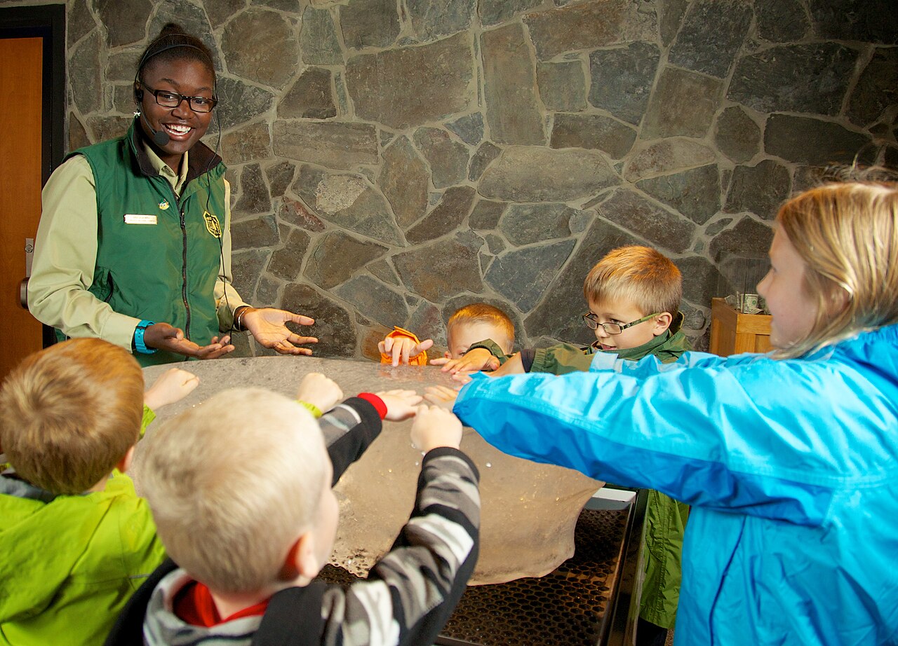 Seedance 2.5 Guide Teaches Shot Design for Product and Storytelling Prompts — Mendenhall Glacier interpretive guide teaches children about the geology of the glacier (12824133775)