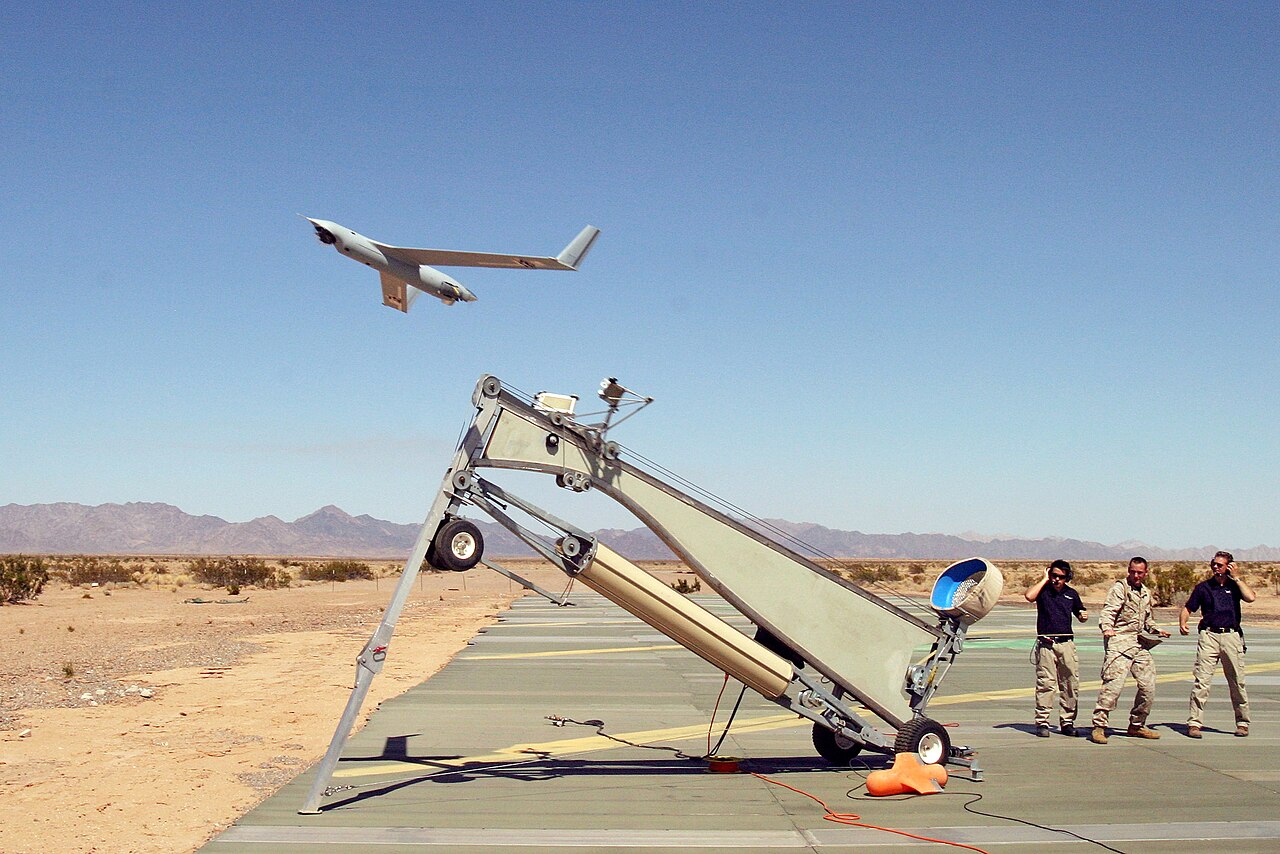 Audible Launches AI-Driven Interactive Stories With Real-Time Voice Synthesis — US Navy 060616-M-9508D-001 U.S. Marine Corps Sgt. Michael Kropiewnicki, a Combat Videographer assigned to 2nd Marine Aircraft Wing (MAW) Combat Camera, launches a Boeing Scan Eagle Unmanned Aerial Vehicle (UAV)