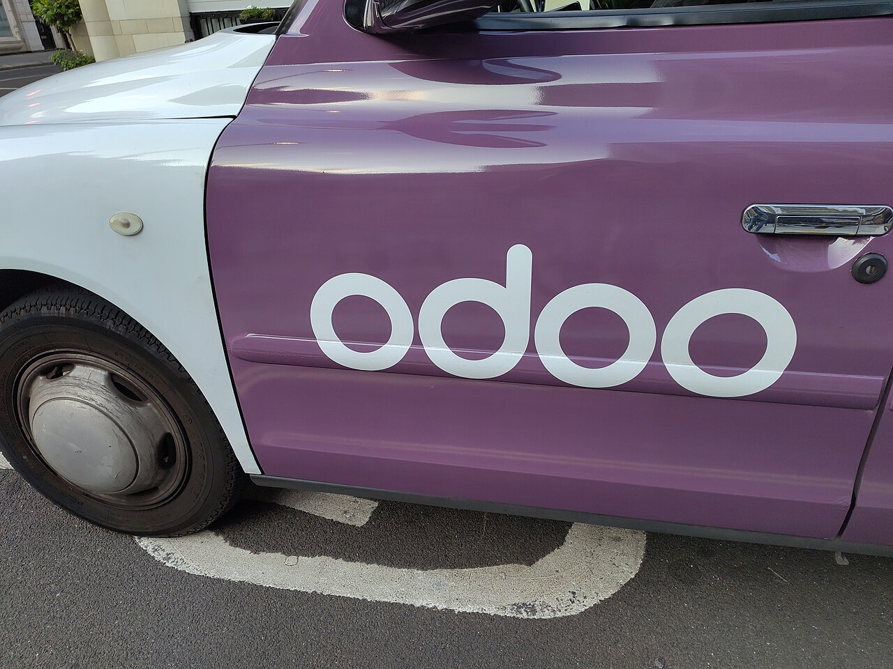 Odoo ERP Development Bridges the Gap Between Spreadsheets and Scalable Infrastructure — Odoo open-source software advertising on a car in the United Kingdom - 16-06-2025