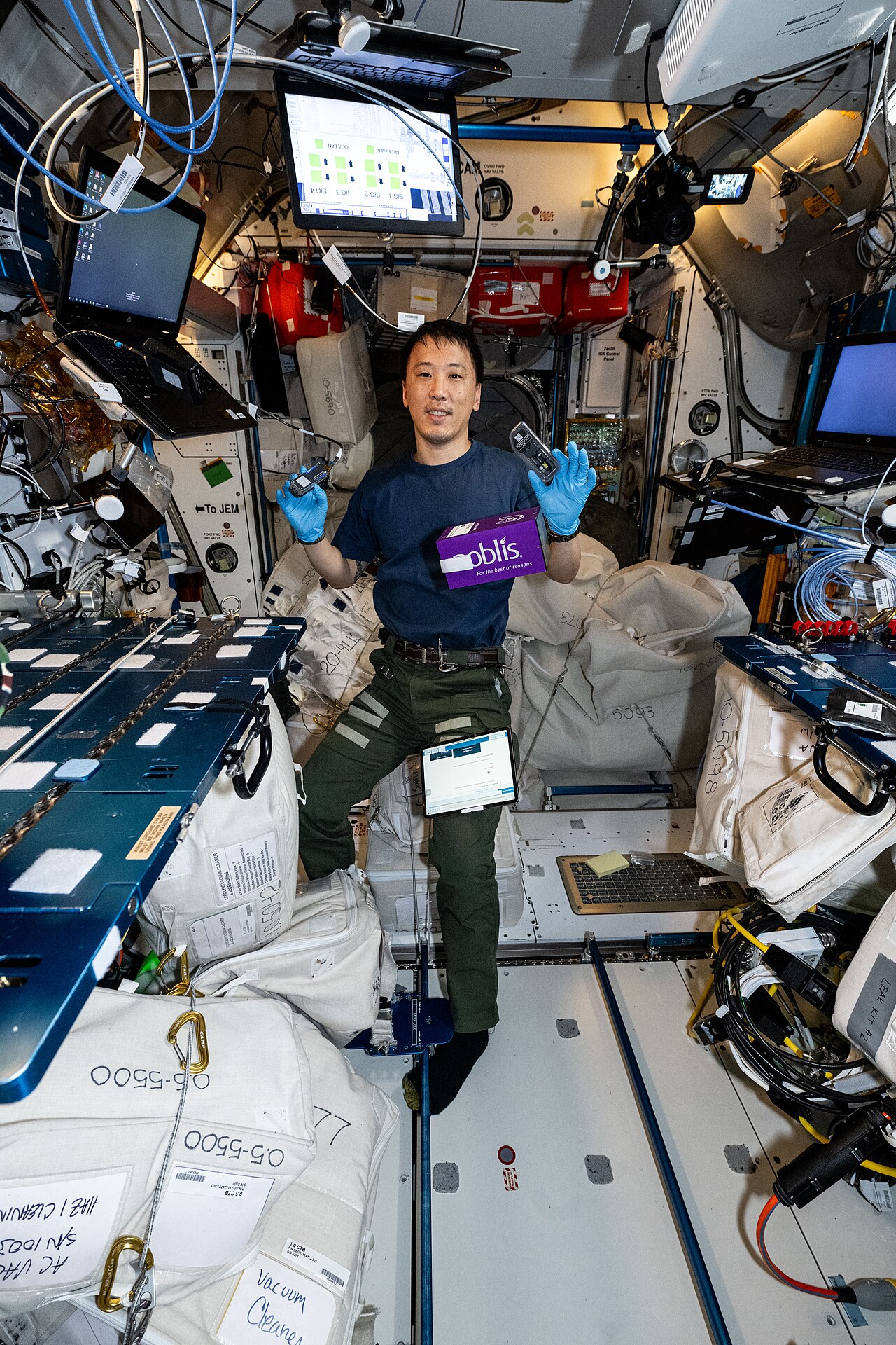 AI Agent Experiment Shows Platform Markets Are Company Towns — NASA astronaut Jonny Kim shows off Voyager DNA Decryption experiment hardware (iss073e0815500)