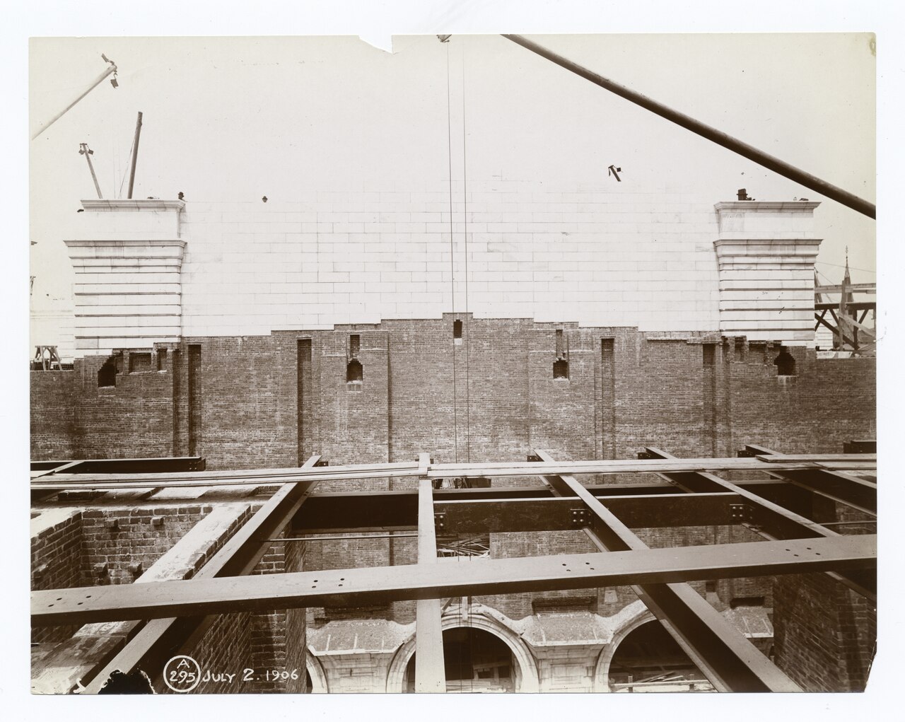 New Audit Framework Exposes Infrastructure Rents in AI Governance Models — Interior work - marble covering part of a brick wall, with exposed structural framework in the foreground (NYPL b11524053-489638)