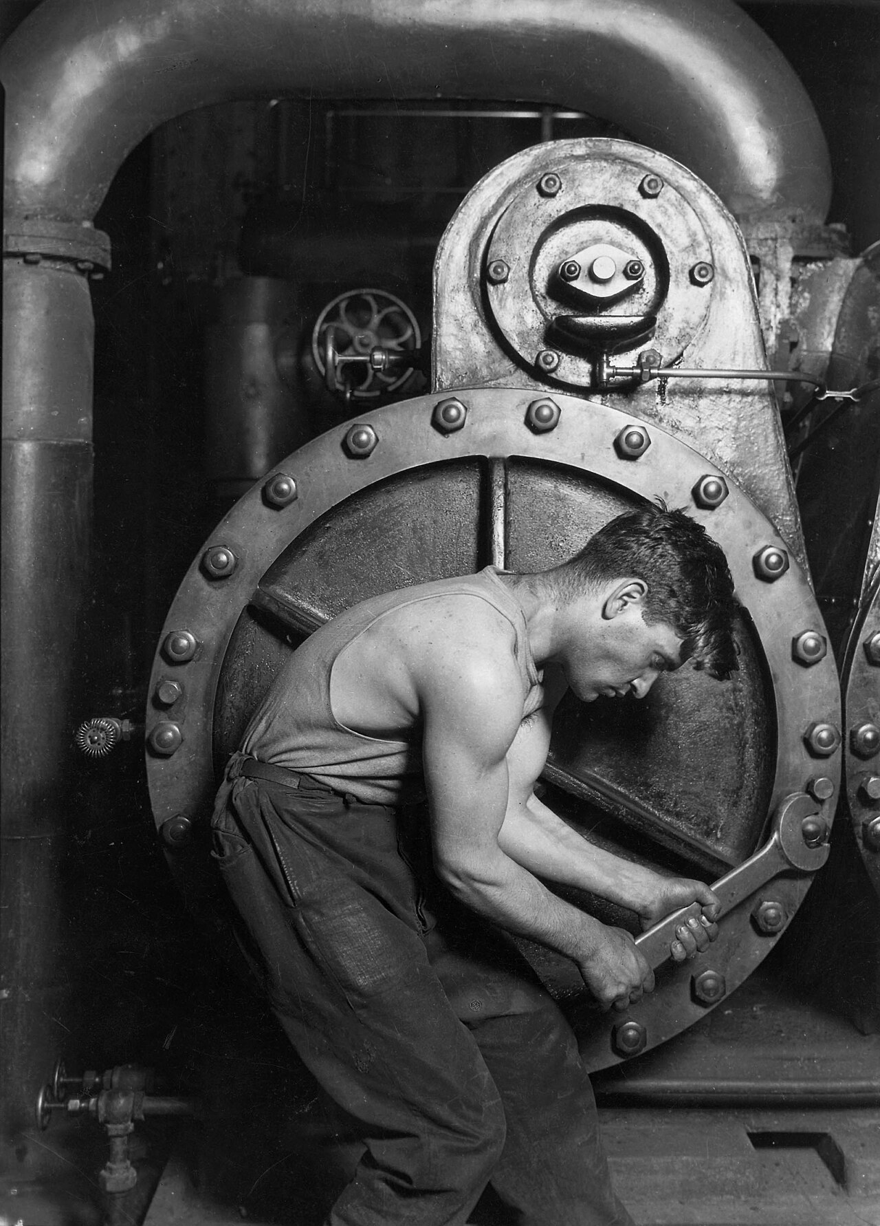 Portability Over Power: Why JSON Schema Matters in Text Moderation Adapters — Lewis Hine Power house mechanic working on steam pump