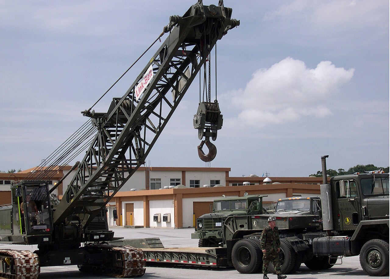 AI Infrastructure Boom Drives Cloud Growth While Free Cash Flow Plummets — US Navy 040521-N-5704B-001 Equipment Operator 2nd Class Jessie Jernigan, drives a 50-ton lattice boom crawler crane